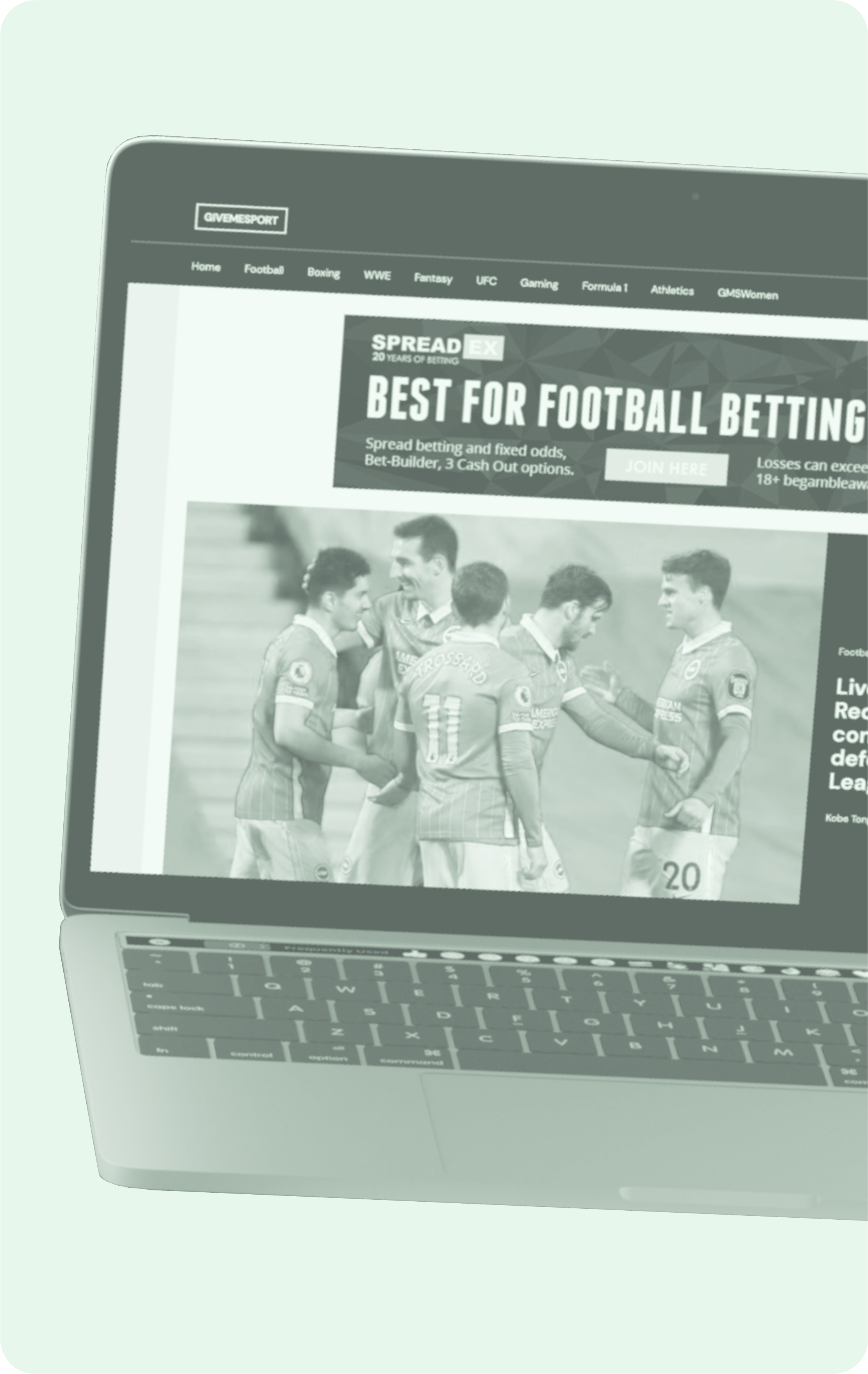 Laptop showing sports website with ads